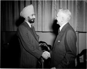 Dale Carnegie [S. S. Jaaj mounts stage to thank Carnegie for success he won as an insurance salesman.]