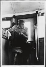 [Crew member working on the ferry.]
