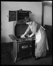 Cleaning gas range.