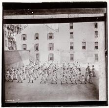 Dumbell excercise in play yard -- public school at Monroe and Market Streets.