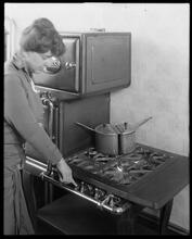 Cleaning gas range.