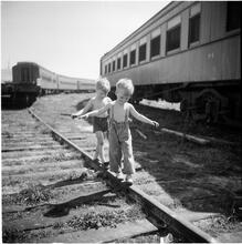 Circus [Boys playing on railroad tracks.]