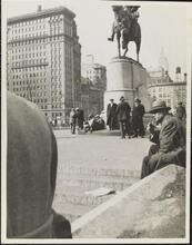 [Men gathered around George Washington statue in Union Square.]