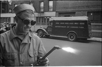 Paddy Wagon [Man with welding equipment used in the making of the television show Paddy Wagon.]