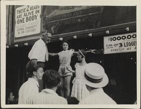 [Sideshow performers on the Coney Island midway.]