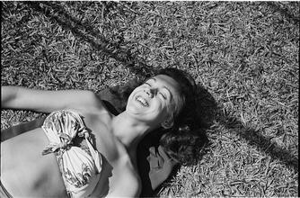 Circus [Circus performer sunbathing.]
