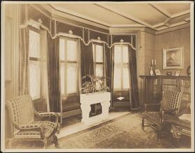 [Interior, library or study.]