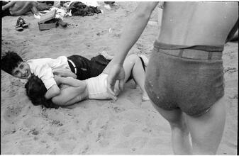 [Teenagers playing on Coney Island beach.]