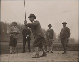 [Al Smith playing golf.]