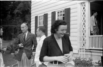 [Social gathering on porch and yard.]