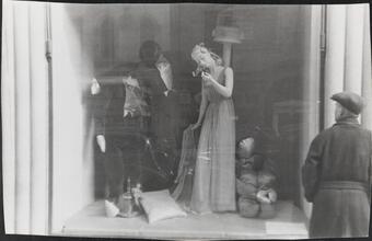 [Man window shopping on 5th Avenue.]