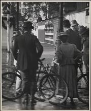 [Bicyclists standing with policeman, Dewey Celebration (?)]