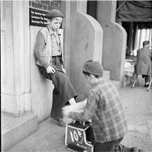 Shoe Shine Boy [Boy shining Mickey's shoes.]