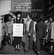 Advertising Sandwich Board [Woman wearing a sandwich board advertising the 1-2-3 cafe.]