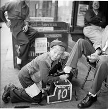 Shoe Shine Boy [Mickey shining shoes.]