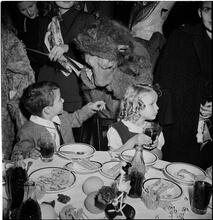 United Nations Children's Party [Child talking to a person in a bear costume.]
