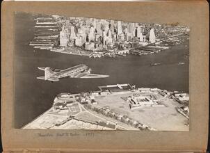 [Plane flying above Governors Island.]