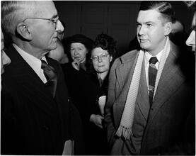 Dale Carnegie [Dale Carnegie talking to a man.]