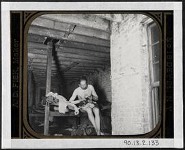Lodger in Pell St. 7 cents lodging house (Happy Jack's Canvas Palace) going to bed.