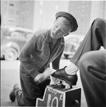 Shoe Shine Boy [Mickey shining shoes.]