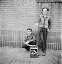 Shoe Shine Boy [Mickey and his friend standing next to a shoe shine stand.]