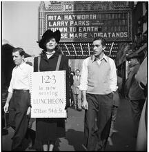 Advertising Sandwich Board [Woman wearing a sandwich board advertising the 1-2-3 cafe.]