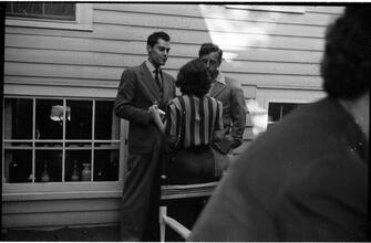 [Unidentified people at outdoor social gathering.]