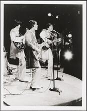 ["Beatlemania" theater still.]