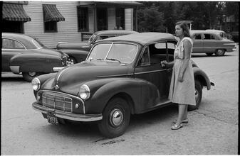 [Felicia Marsh standing next to car.]