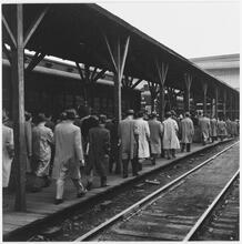 The Weehawken Ferry Story [Commuters at a train station.]