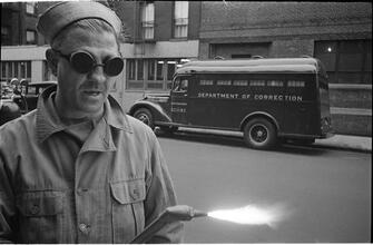 Paddy Wagon [Man with welding equipment used in the making of the television show Paddy Wagon.]