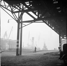 Waterfront. [Under an elevated railway.]