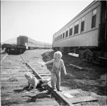 Circus [Children playing on train tracks.]