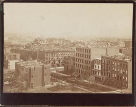 [View from the roof of George Ehret's home at Park Avenue and 94th Street.] Looking southeast, showing 93rd Street and Lexington Avenue. The litte frame house on 93rd between Park and Lexington Avenue