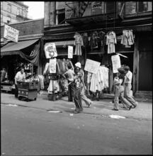 [Shoe store and clothing store on Orchard Street.]