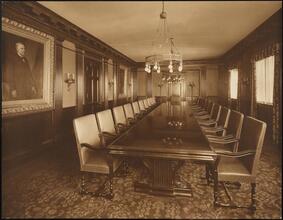 [Interior, board room.]