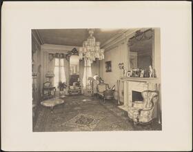 [Residence. Interior, parlor.]