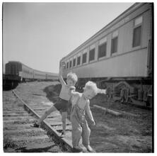 Circus [Boys playing on railroad tracks.]