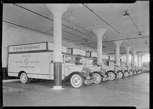 Rex Cole garage. Sharp view of line of trucks.