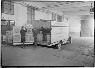 Rex Cole [Warehouse]. Loading platform, truck being loaded.