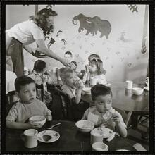 Orphanage [Children eating at a table.]
