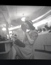 Women Trying on Hats