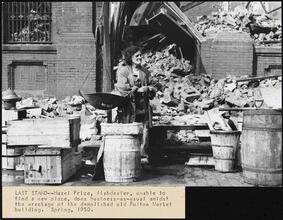 Last Stand. [Woman selling fish amidst the demolition of the Fulton Fish Market.]