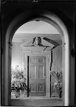 Embassy Club. Detail door thru arch.