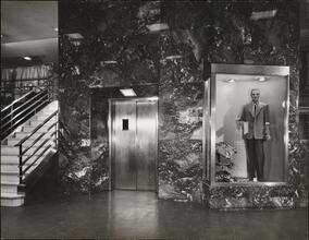 [Interior of Crawford Store showing staircase. elevator and mannequin.]