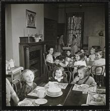Orphanage [Children eating at a table.]