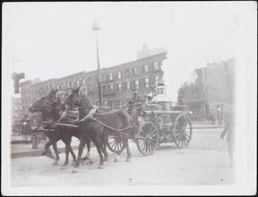 [Horse-drawn fire engine.]