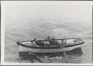 [Vessel crew rowing boat.]