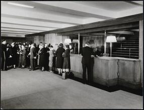 [Interior, lobby with reception desk.]