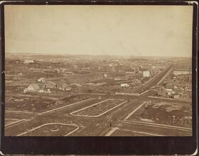 [View from the roof of George Ehret's home at Park Avenue and 94th Street.] Looking northwest, showing High Bridge and water tower in the distance.